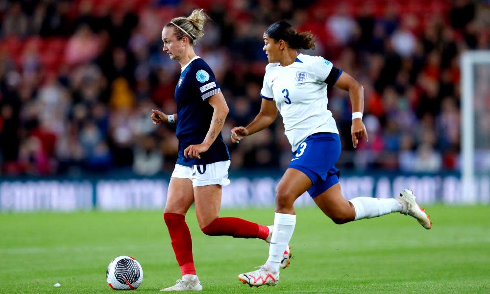 Martha Thomas dribbles away from Jess Carter during England v Scotland in the Nations League.