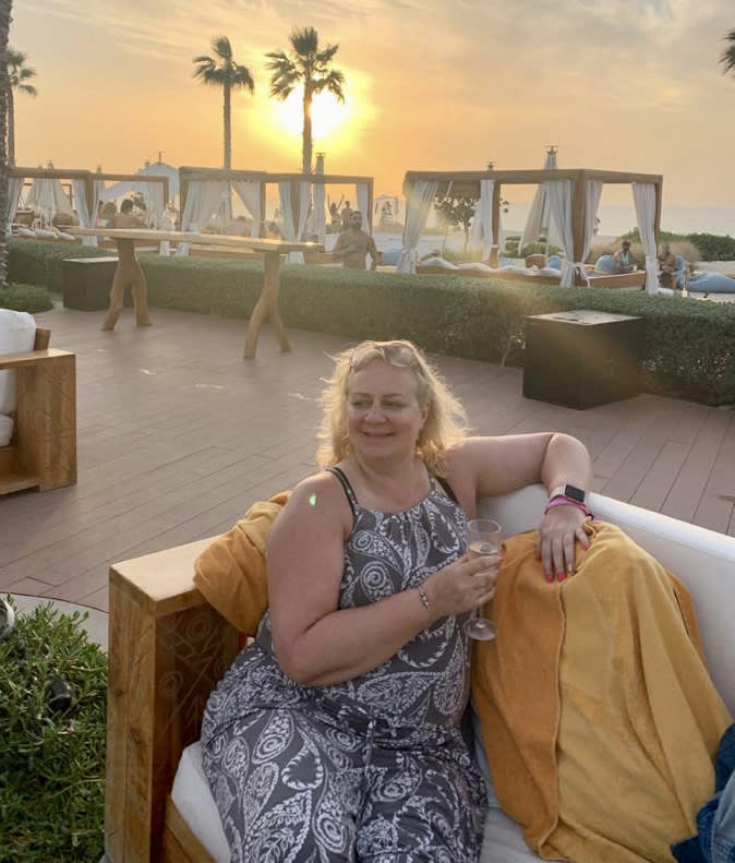 Liz Long says her IBS symptoms were so extreme it was difficult to concentrate on work. (Pictured on holiday before treatment). (Supplied)