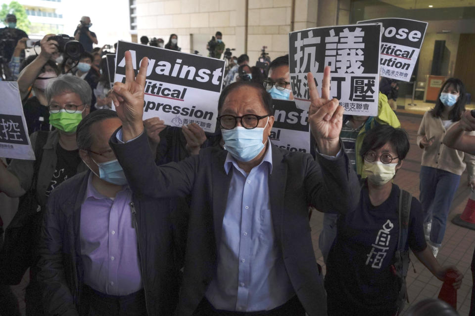 Pro-democracy activist Yeung Sum leaves a court after receiving a suspended sentence in Hong Kong, Friday, April 16, 2021. A Hong Kong court on Friday sentenced five leading pro-democracy advocates, including media tycoon Jimmy Lai, to up to 18 months in prison for organizing a march during the 2019 anti-government protests that triggered an overwhelming crackdown from Beijing. (AP Photo/Kin Cheung)