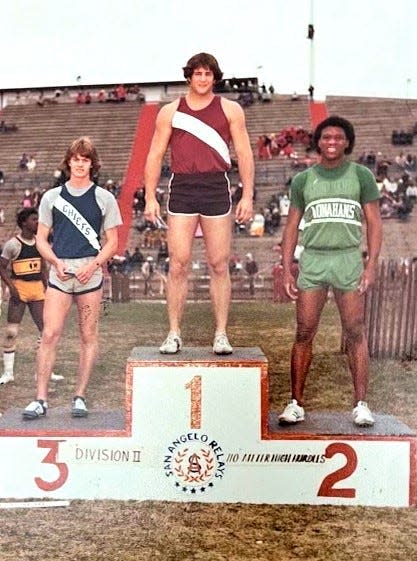 Mike Kinsey on the medal stand at the San Angelo Relays. The Brownwood athlete beat Merv Scurlark of Monahans to win the high hurdles. The two later reunited as Texas Tech football players.