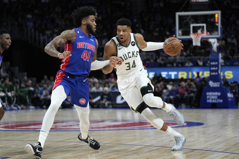 Bucks forward Giannis Antetokounmpo drives on Pistons forward Saddiq Bey in the first half on Monday, Jan. 23, 2023, at Little Caesars Arena.