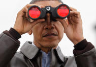 <p>President Barack Obama looks through binoculars to see North Korea from Observation Post Ouellette in the Demilitarized Zone, the tense military border between the two Koreas, in Panmunjom, South Korea, Sunday, March 25, 2012. (AP Photo/Pablo Martinez Monsivais) </p>