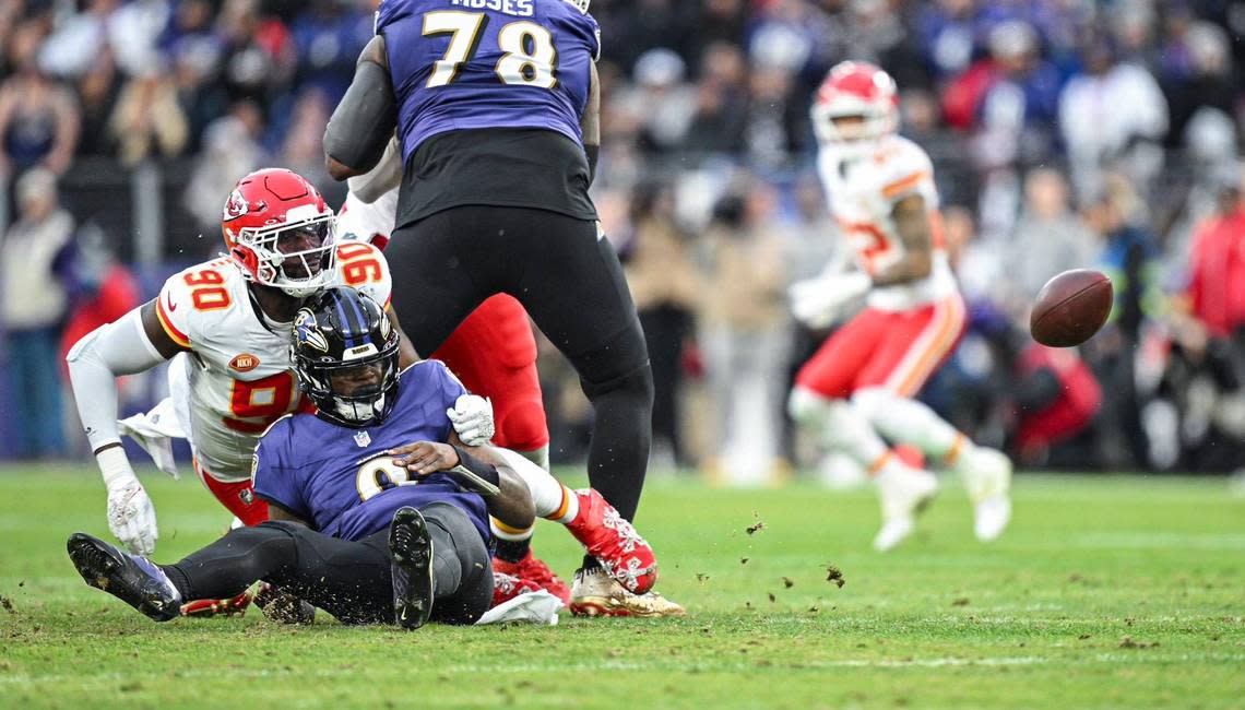 Kansas City Chiefs defensive end Charles Omenihu (90) forces Baltimore Ravens quarterback Lamar Jackson (8) to fumble in the second quarter Sunday, Jan. 28, 2024, during the AFC Championship Game in Baltimore. Nick Wagner/nwagner@kcstar.com