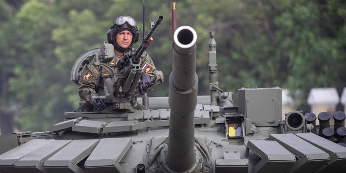 A close-up of the front of a Russian T-72B3, with a soldier, during a 2020 parade rehearsal in Moscow, Russia.