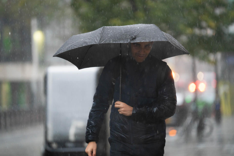 People walk in the rain near the Home Office in central London. A week's worth of rain could fall in just a few hours across parts of the UK on Tuesday as wet weather continues to batter the country. Picture date: Tuesday November 14, 2023. (Photo by James Manning/PA Images via Getty Images)