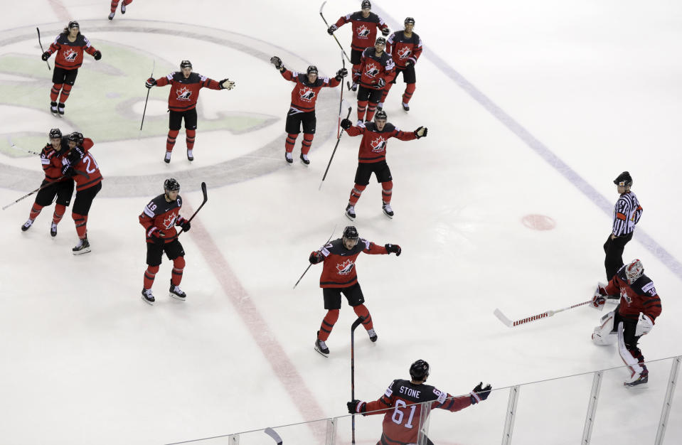 Canada's Mark Stone, foreground, celebrates after scoring his side's third goal during the Ice Hockey World Championships quarterfinal match between Canada and Switzerland at the Steel Arena in Kosice, Slovakia, Thursday, May 23, 2019. (AP Photo/Petr David Josek)