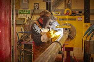 A qualified craftsman performs welding work at Lloydminster Upgrader.