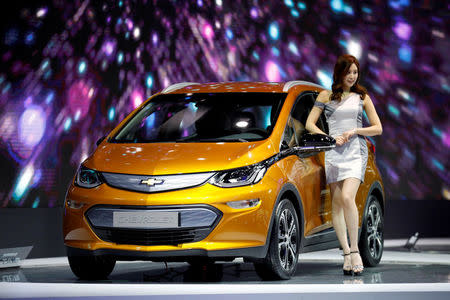 FILE PHOTO: A model poses with a Chevrolet Bolt EV during the 2017 Seoul Motor Show in Goyang, South Korea, March 31, 2017. REUTERS/Kim Hong-Ji/File Photo