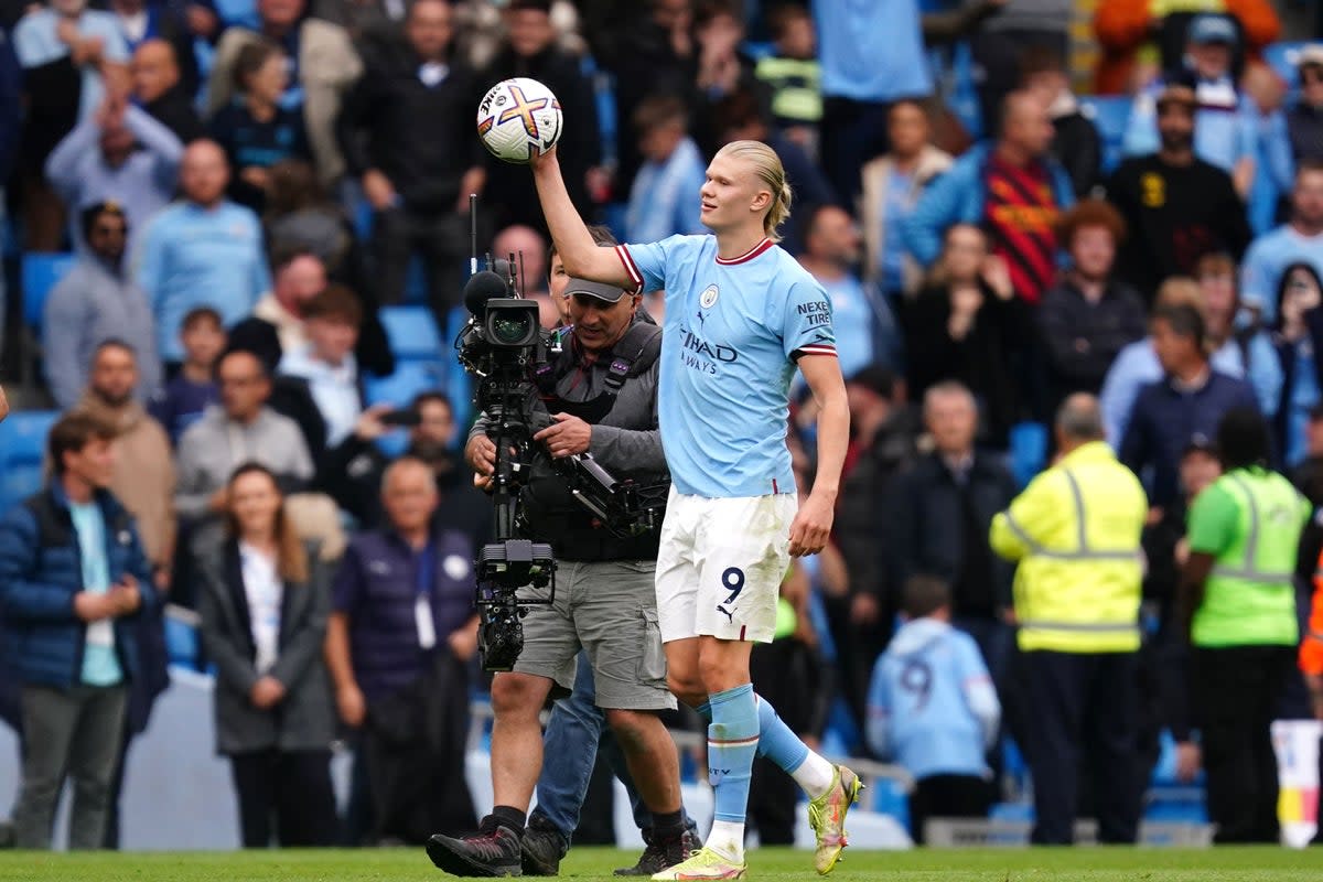 Manchester City’s Erling Haaland celebrates with the match ball following a 6-3 derby victory over Manchester United (Martin Rickett/PA) (PA Wire)