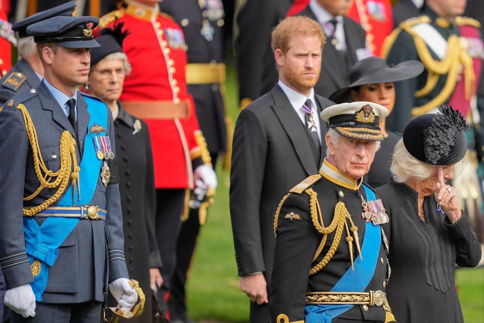 Harry (centre) is reportedly flying to visit his father (AP)