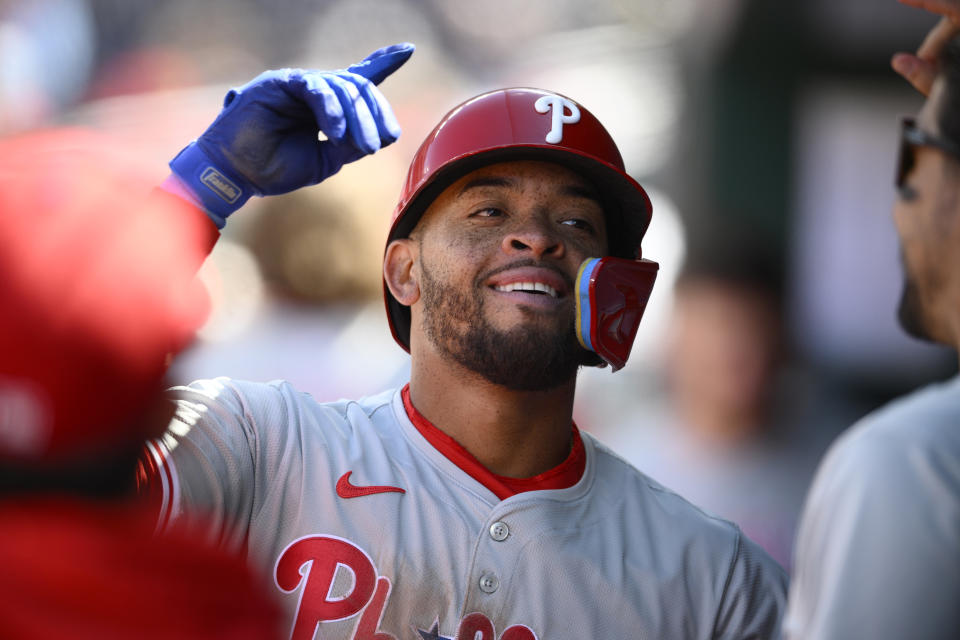 Philadelphia Phillies' Edmundo Sosa celebrates his home run in the dugout during the fifth inning of a baseball game against the Washington Nationals, Sunday, April 7, 2024, in Washington. (AP Photo/Nick Wass)