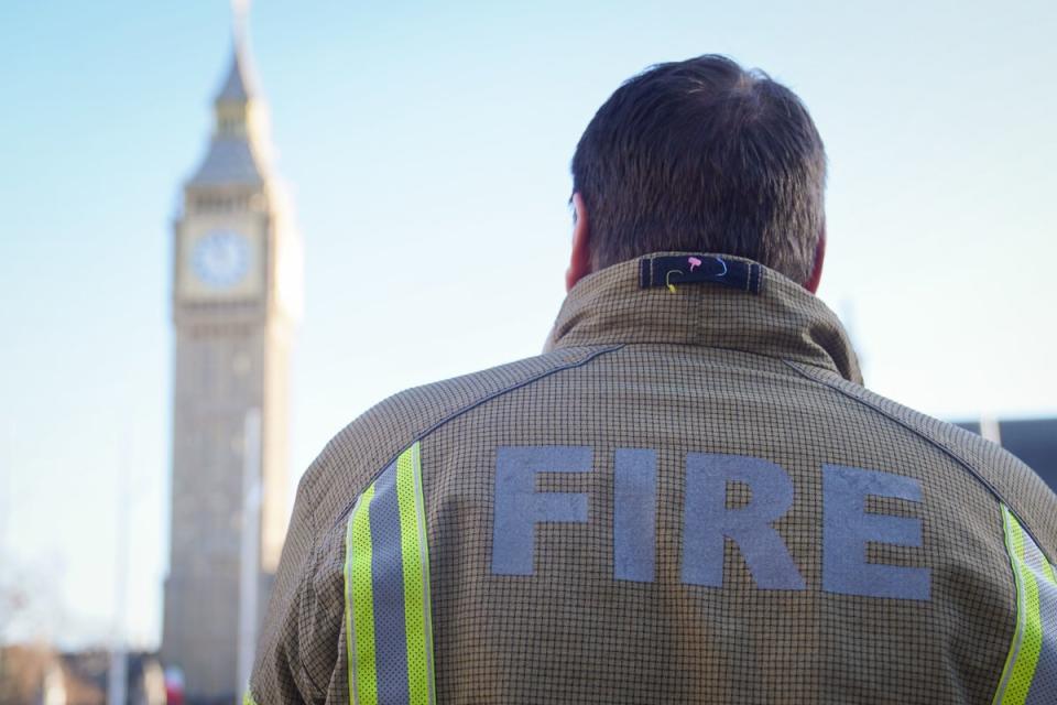 6 December 2022: A firefighter in Parliament Square, central London, ahead of a rally to mark the start of a ballot for strikes in a dispute over pay (PA)