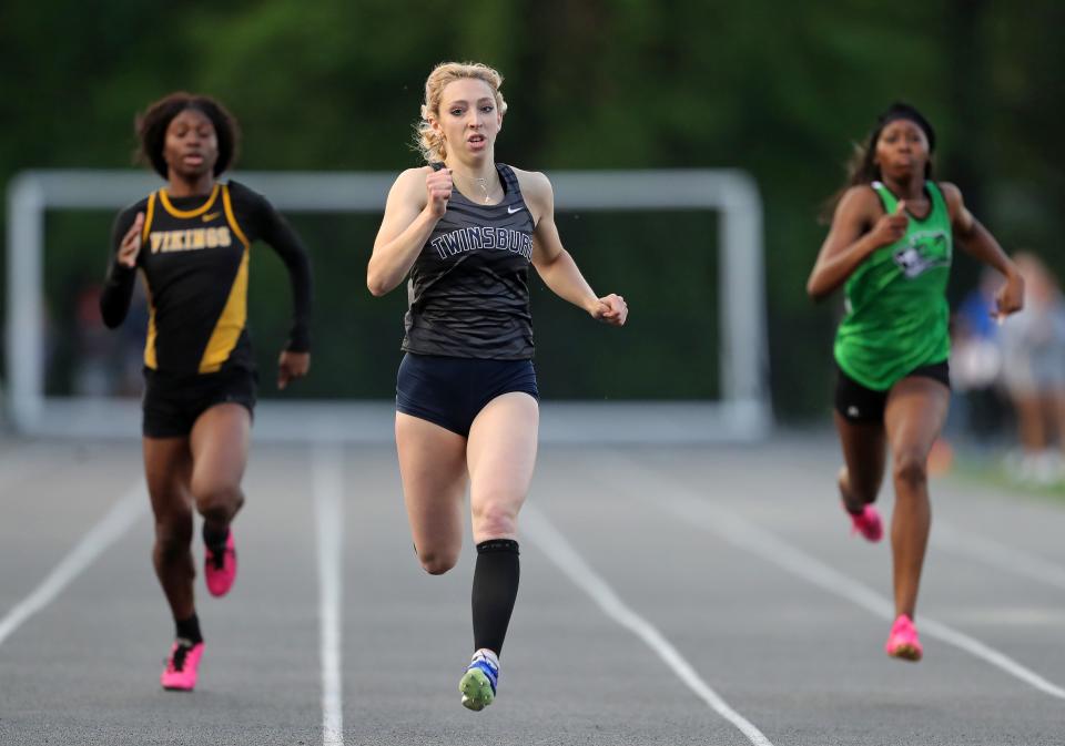 Savannah Swanda of Twinsburg, center, nears the finish in the girls 200 meter dash during the Division I district track meet at Nordonia High School, Friday, May 17, 2024, in Macedonia, Ohio.