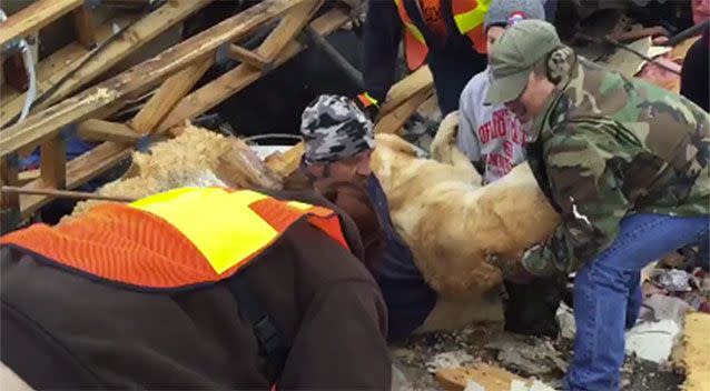 The moment 'miracle dog' Sawyer is pulled from the rubble. Source: Supplied.