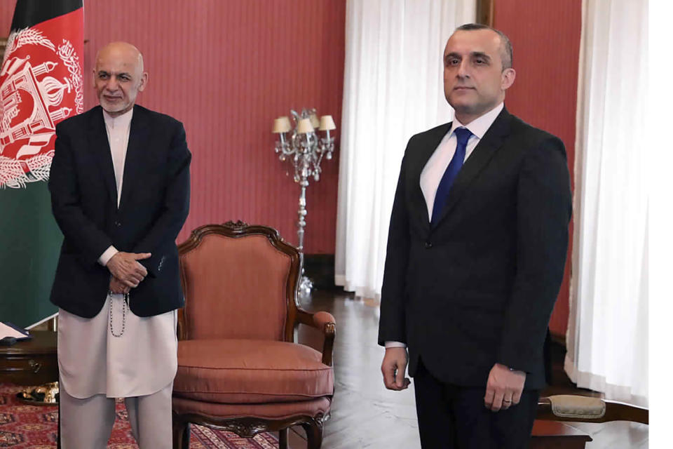 FILE - In this March 23, 2020, file photo, First Vice President Amrullah Saleh, right, and Afghan President Ashraf Ghani,left, attend a meeting with U.S. Secretary of State Mike Pompeo, at the Presidential Palace in Kabul. Afghan officials claimed a failed assassination attempt against Afghanistan's first vice president Saleh. Razwan Murad, a spokesman for the first vice president said Wednesday, Sept. 9, that the enemies of Afghanistan again tried to harm Saleh, but the vicious and terrorist attempt has failed and Saleh has survived. (Afghan Presidential Palace via AP, File)