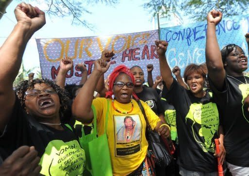 Women farmers demonstrate outide the UN climate change talks in Durban. Bearing the message that their livelihoods were in peril, hundreds of women farmers tried Friday to gatecrash UN climate talks in Durban, where they were peacefully held back by police