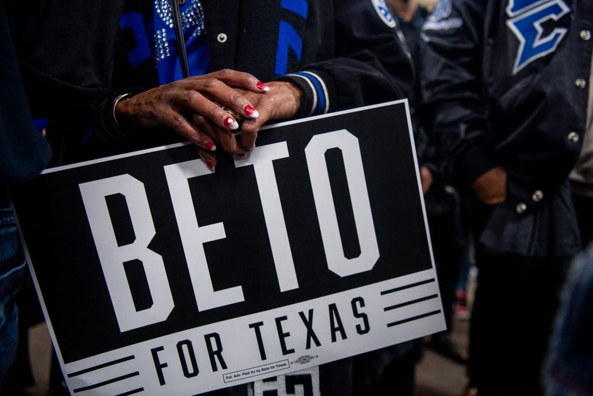 A supporter carries a Beto O’Rourke sign during a rally at Prairie View A&M University on February 25, 2022 in Prairie View, Texas. (Photo by Brandon Bell/Getty Images)
