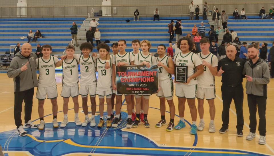 The Oakmont Regional boys basketball team celebrates winning back-to-back Central Mass. Class B championships following the Spartans' 55-48 win over Worcester Tech, Friday afternoon, at Worcester State University.