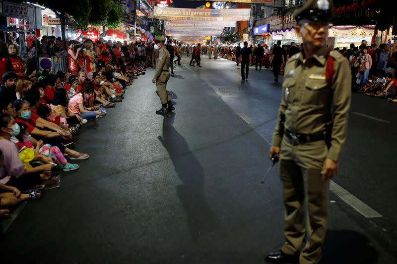 A police officer wears a mask during the celebration of the Chinese Lunar New Year in Chinatown in Bangkok