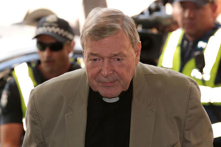 Cardinal George Pell arrives at the Melbourne Magistrates Court in Melbourne, Australia, March 5, 2018. AAP/Stefan Postles/via REUTERS