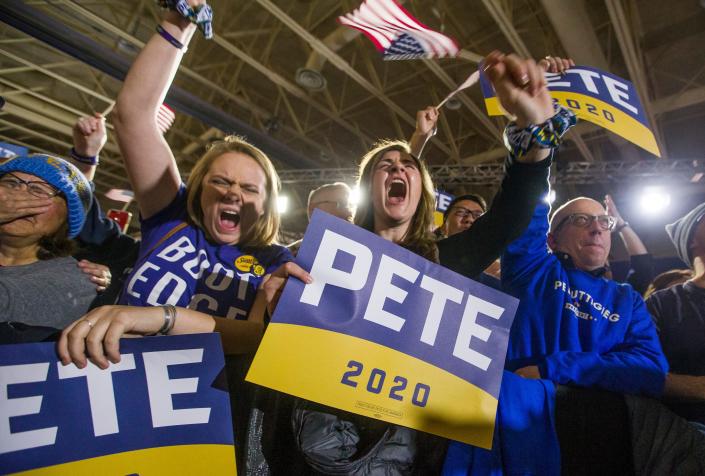 Supporters of former South Bend Mayor Pete Buttigieg cheer at his Iowa caucus watch party at Drake University in Des Moines.