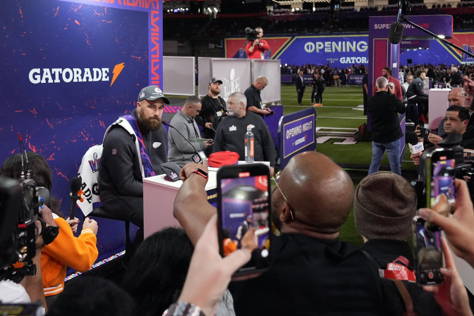 Kansas City Chiefs tight end Travis Kelce, left, participates in the NFL football Super Bowl 58 opening night, Monday, Feb. 5, 2024, in Las Vegas. The San Francisco 49ers face the Kansas City Chiefs in Super Bowl 58 on Sunday. (AP Photo/Godofredo A. Vásquez)