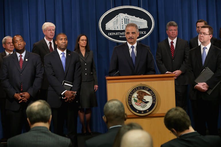 U.S. Attorney General Eric Holder leads a news conference with Acting Associate Attorney General Tony West, Principal Deputy Assistant Attorney General Stuart Delery and attorneys general from eight states and the District of Columbia at the Department of Justice February 5, 2013 in Washington, DC. Holder announced that the United States is bringing a civil lawsuit against the ratings agency S&P