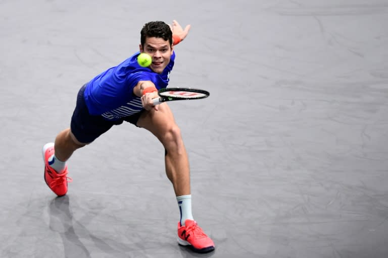 Canada's Milos Raonic returns the ball to Spain's Pablo Carreno Busta during the ATP World Tour Masters 1000 indoor tournament in Paris on November 1, 2016