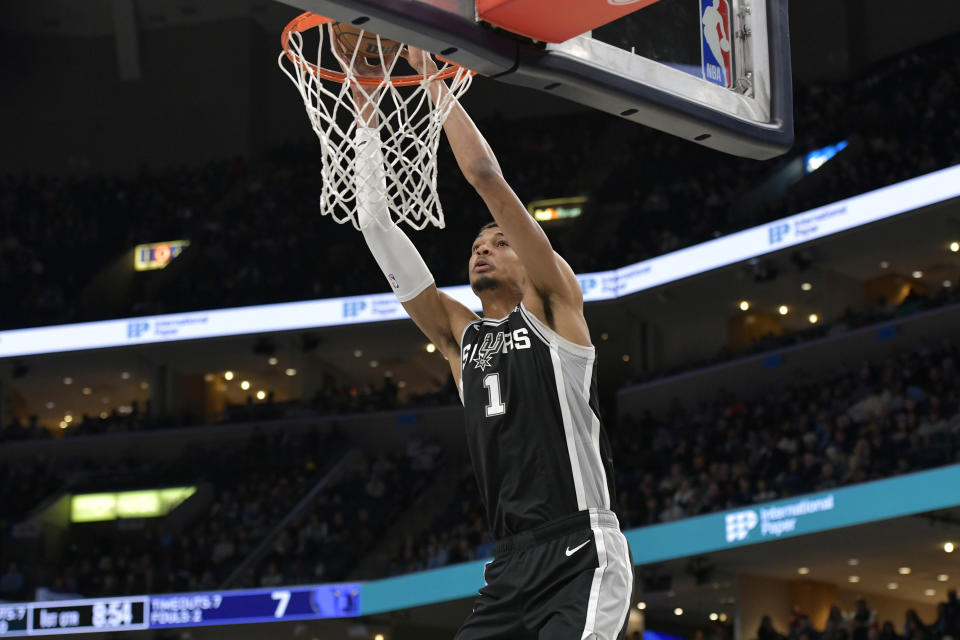 San Antonio Spurs center Victor Wembanyama dunks against the Memphis Grizzlies during the first half of an NBA basketball game Tuesday, Jan. 2, 2024, in Memphis, Tenn. (AP Photo/Brandon Dill)