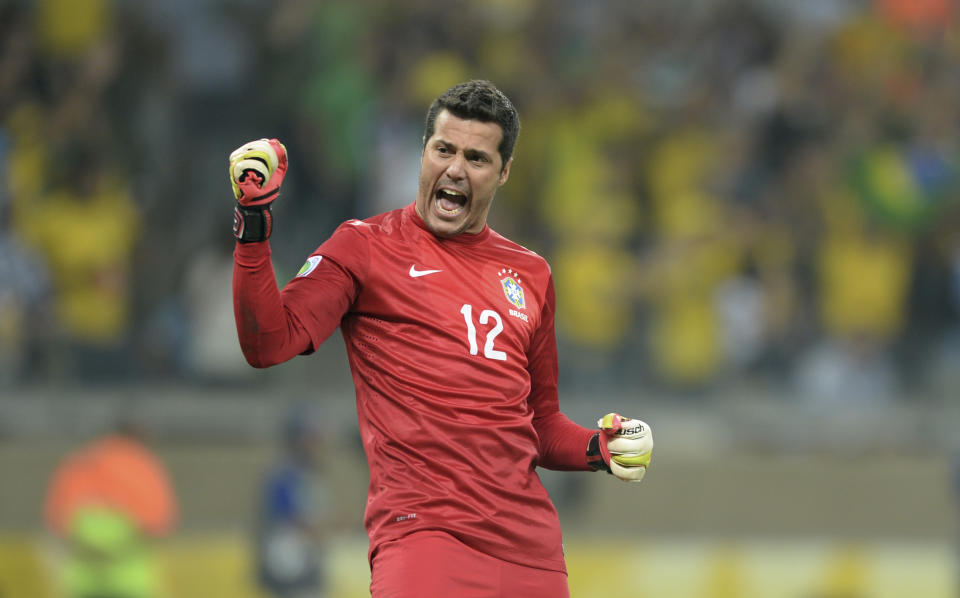 FILE - In this June 26, 2013 file photo, Brazil's Julio Cesar celebrates his team's 2-1 victory at a Confederations Cup semifinal soccer match with Uruguay in Belo Horizonte, Brazil. Cesar is the weakest link in the national team which all of Brazil expects to win the 2014 World Cup. That is no accident: Brazil has long paid far more attention to players who score and make goals than to those who save them. (AP Photo/Eugenio Savio, File)