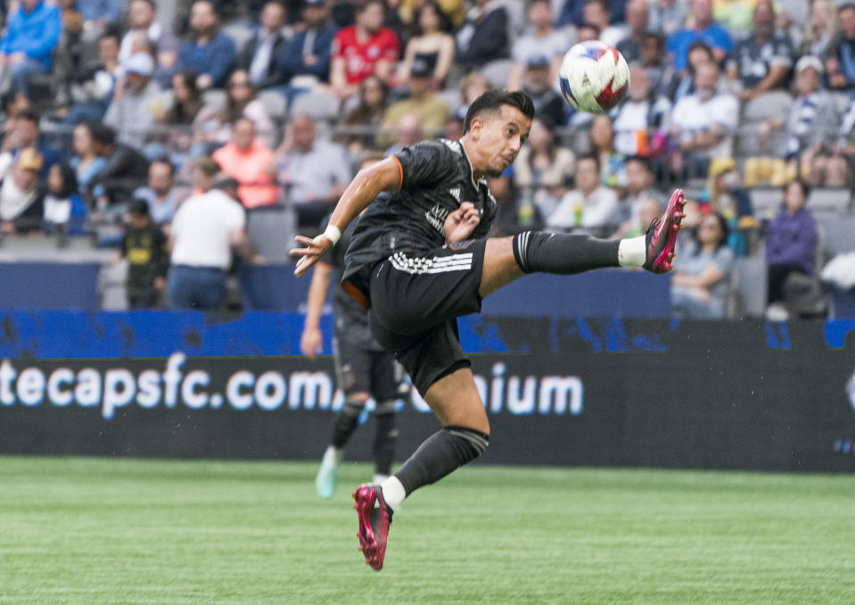 Houston Dynamo's Amine Bassi receives a pass before scoring a goal against the Vancouver Whitecaps during the first half of an MLS soccer match Wednesday, May 31, 2023, in Vancouver, British Columbia. (Rich Lam/The Canadian Press via AP)