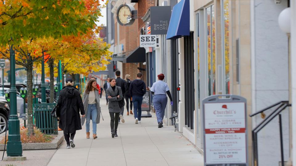 People walking on North Old Woodward near Maple Road in downtown Birmingham.