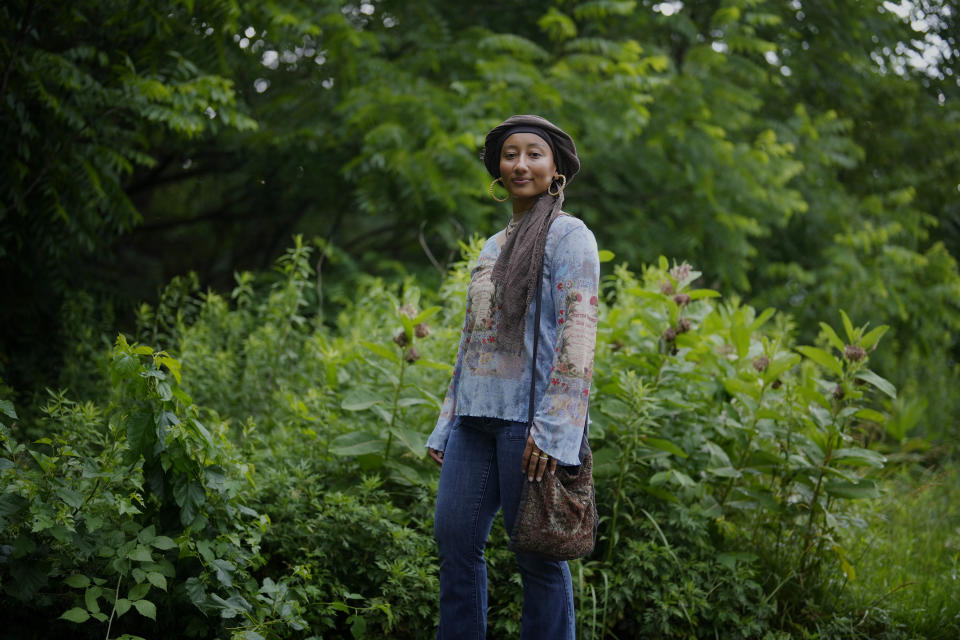 Yasmeen Bekhit, a 22-year-old graduate student, poses for a photograph in her Y2K-inspired outfit near her home in Manheim, Pa., Tuesday, June 27, 2023. If there’s one thing retailers will tell you, it’s that Gen Z hasn’t let up on early 2000s trends that are booming in popularity two decades later. (AP Photo/Matt Slocum)