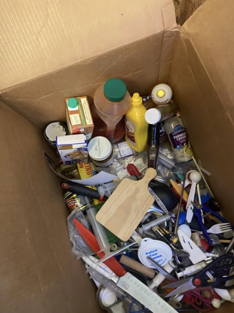Kitchen items thrown into a box