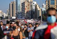 People march during a demonstration in Beirut