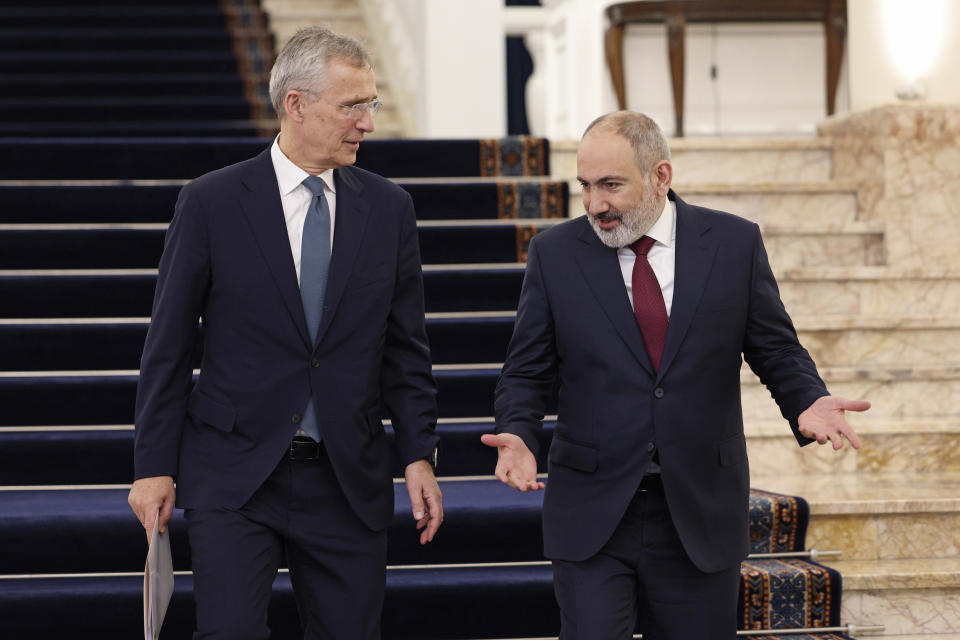 Armenia's Prime Minister Nikol Pashinyan, right, and NATO Secretary General Jens Stoltenberg walk to make joint statements after their meeting in Yerevan, Armenia, Tuesday, March 19, 2024. (Stepan Poghosyan/Photolure via AP)