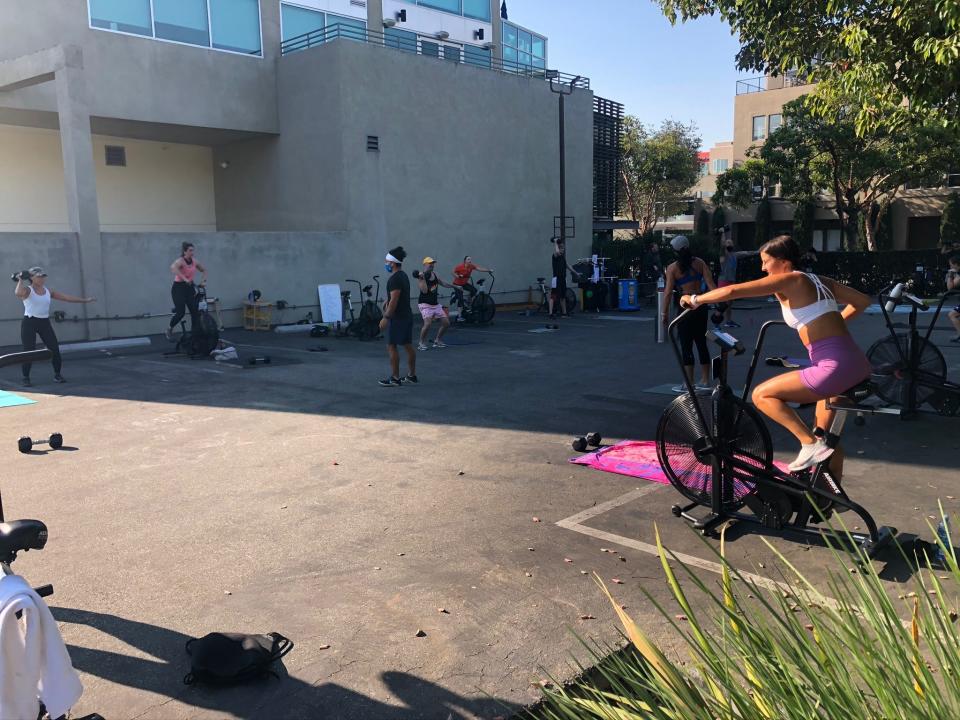 Basecamp Fitness uses an outdoor area near their still-closed studio to host workout classes.