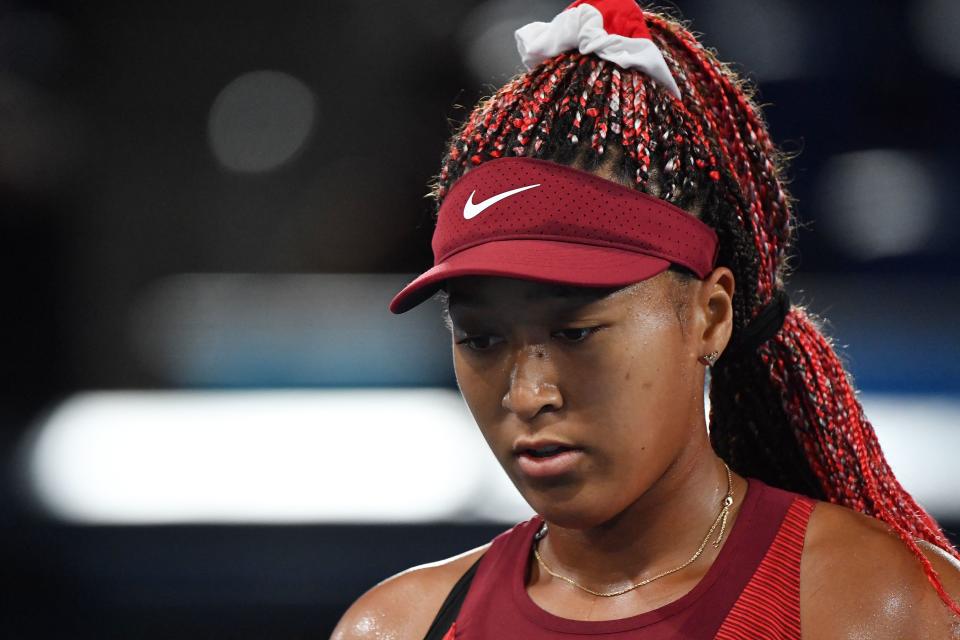 Japan's Naomi Osaka competes against Czech Republic's Marketa Vondrousova during their Tokyo 2020 Olympic Games women's singles third round tennis match at the Ariake Tennis Park in Tokyo on July 27, 2021. (Photo by Tiziana FABI / AFP) (Photo by TIZIANA FABI/AFP via Getty Images)