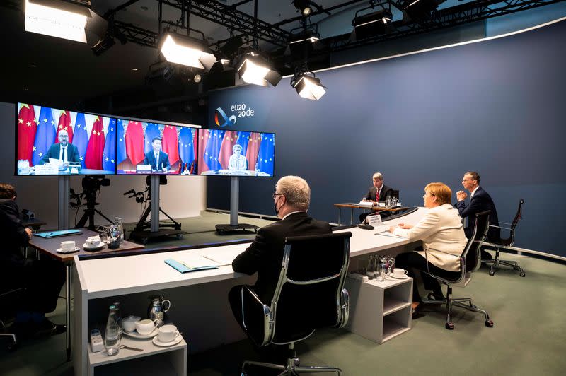 A government handout shows German Chancellor Merkel during a video conference with European Council President Michel, European Commission President von der Leyen and China's President Xi Jinping at the Chancellery in Berlin