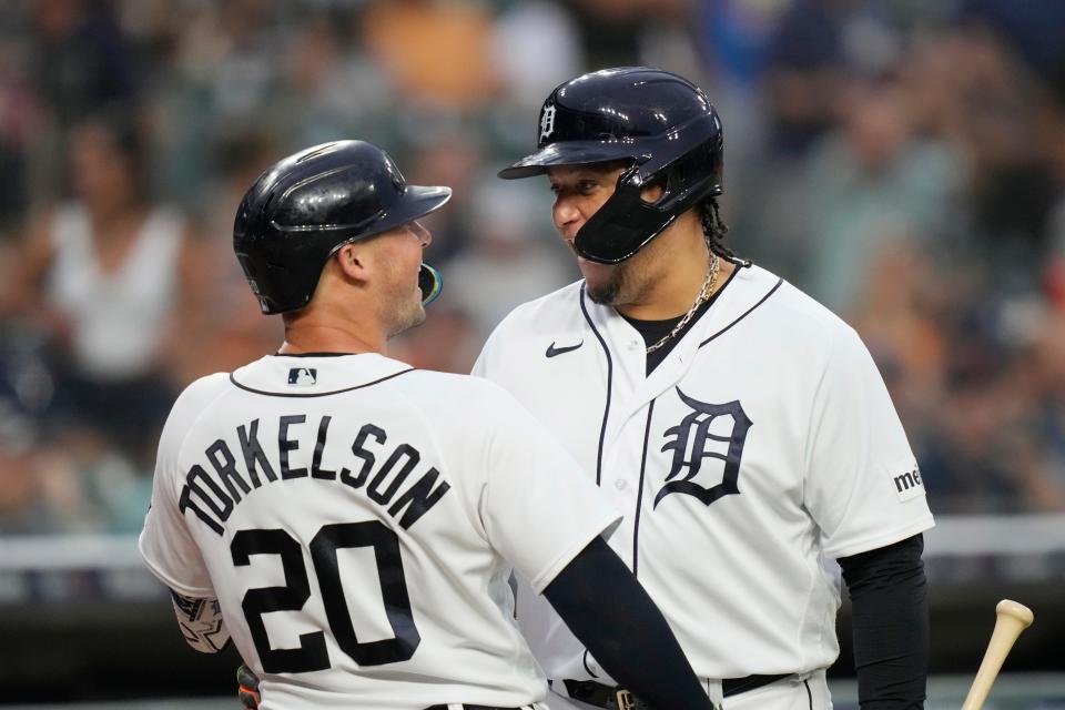 Detroit Tigers' Spencer Torkelson talks to designated hitter Miguel Cabrera after a solo home run during the fifth inning against the Minnesota Twins at Comerica Park in Detroit on Wednesday, Aug. 9, 2023.
