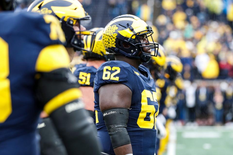 Michigan offensive lineman Raheem Anderson (62) warms up before the Indiana game at Michigan Stadium in Ann Arbor on Saturday, Oct. 14, 2023.