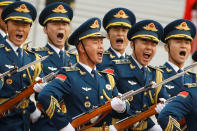 <p>Military troops march during a welcoming ceremony for U.S. President Donald Trump in Beijing, China, Nov. 9, 2017. (Photo: Thomas Pete/Reuters) </p>