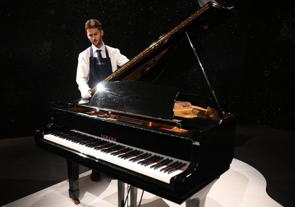 Freddie Mercury's Yamaha G-2 baby grand piano, is pictured during a press preview ahead of the "Freddie Mercury: A World of His Own" auctions, at Sotheby's auctioneers in London on Aug. 3, 2023. The piano is set to go for 2-3 million pounds ($2.5-3.8 million). Sotheby's are set to present the items over six auctions from Sept. 6-11, 2023.