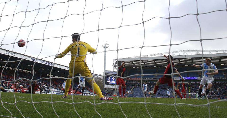 Blackburn Rovers' Chris Taylor (R) scores during their FA Cup fourth round soccer match against Swansea City at Ewood Park in Blackburn, northern England January 24, 2015. REUTERS/Andrew Yates (BRITAIN - Tags: SPORT SOCCER)