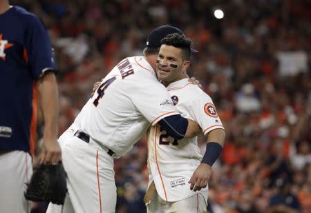 Oct 14, 2017; Houston, TX, USA; Houston Astros second baseman Jose Altuve (27) celebrates with manager A.J. Hinch (14) after defeating the New York Yankees game two of the 2017 ALCS playoff baseball series at Minute Maid Park. Mandatory Credit: Thomas B. Shea-USA TODAY Sports