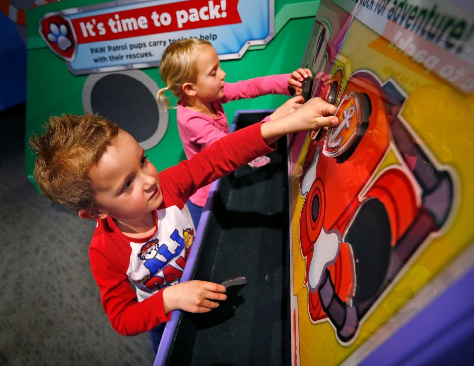 Zachary and Zoey Suding, 4, play with interactive magnets in the PAW Patrol: Adventure Play Exhibit at the Children's Museum of Indianapolis, Tuesday, Feb. 26, 2019.