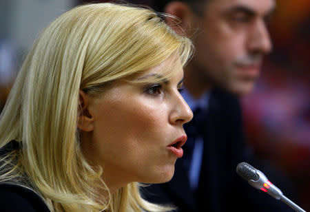 FILE PHOTO: Romania's Tourism Minister Elena Udrea speaks in front of a parliamentary commission at Romania's Parliament palace in Bucharest, Romania, August 20, 2009. REUTERS/Bogdan Cristel/File Photo