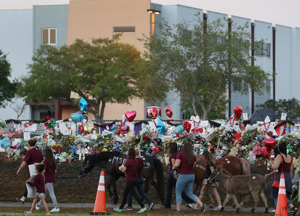 People arrive to offer support.