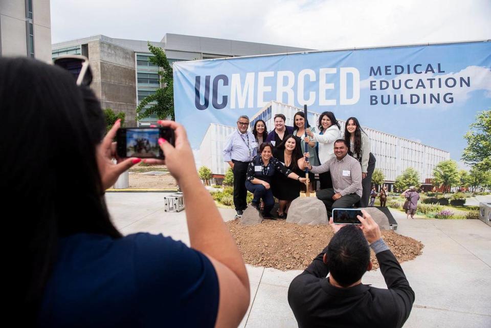 Attendees have their photo taken with a ceremonial shovel during a groundbreaking ceremony for the University of California, Merced Medical Education Building on the university’s campus in Merced, Calif., on Tuesday, May 14, 2024. Construction of the $300 million 203,500 square foot facility, is expected to be completed in the fall of 2026.