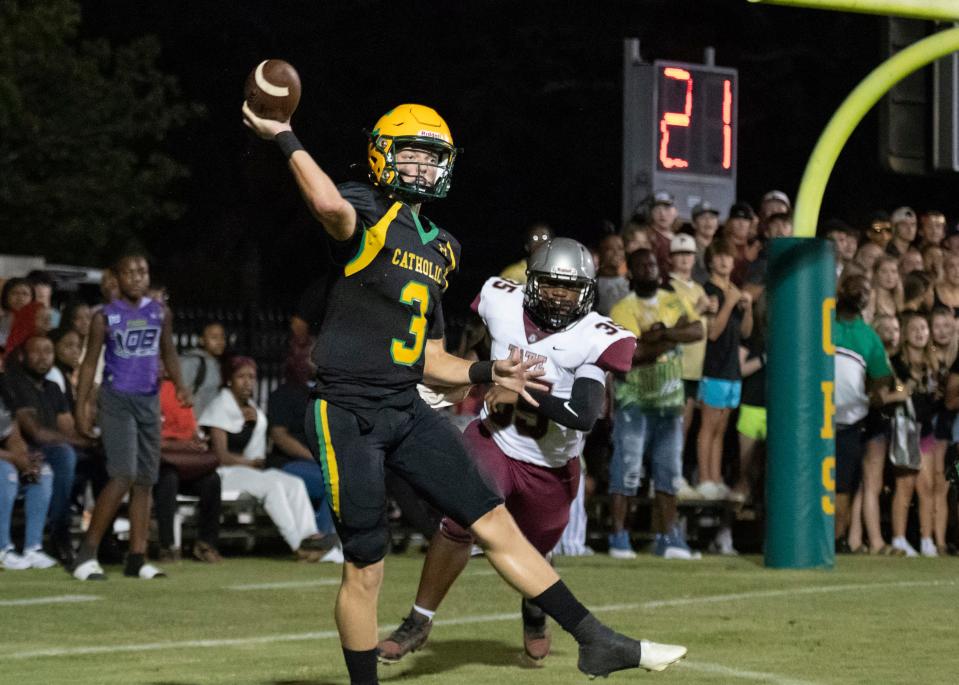 Quarterback Aidan Byrd (3) throws out of his own end zone during the Tate vs Catholic varsity Kickoff Classic football game at Pensacola Catholic High School in Pensacola on Friday, Aug. 19, 2022.